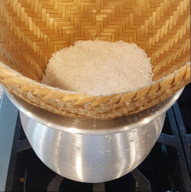 Traditional way of steaming rice